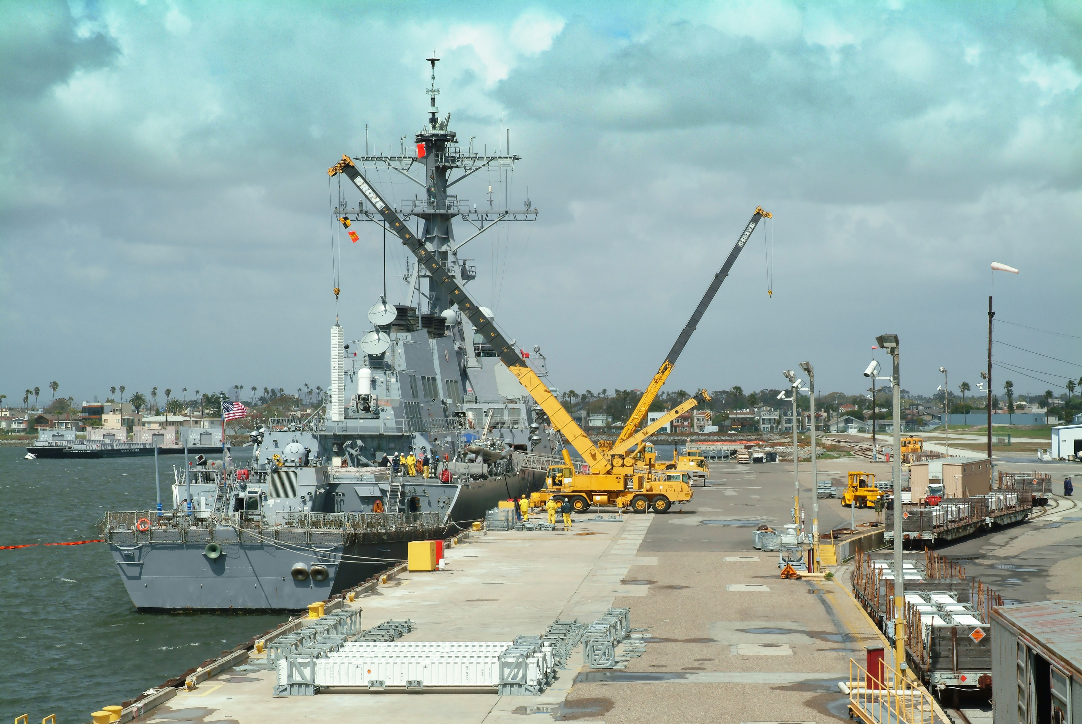 A guided missile destroyer is loaded with munitions a the Seal Beach Naval Weapons Station